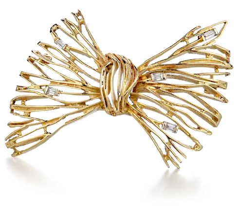 John Donald, Brooch of 18ct yellow gold radiating wires set baguette diamonds