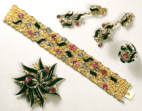 John Donald, A set of 18ct yellow gold flame shapes set individually cut flame shapes lapis lazuli, with pink tourmalines and diamonds